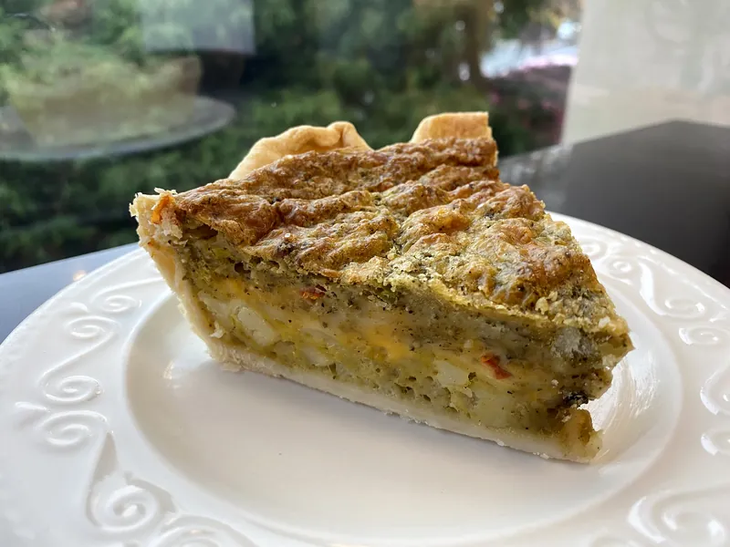 Green chile and cheese quiche slice